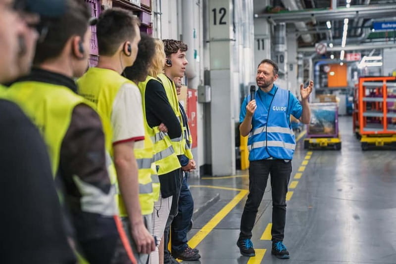 Berlin: BMW Motorrad Production – See How Bikes Are Built - Headsets, safety waistcoat, and why they improve the tour