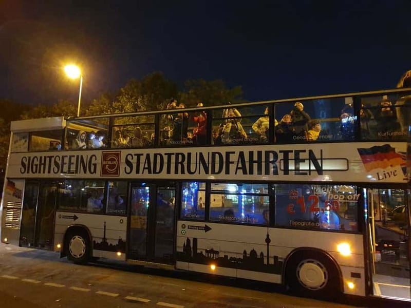 Berlin: Bus Tour by Night with Live Commentary - Alexanderplatz: Red Town Hall and the World Clock in Night Light