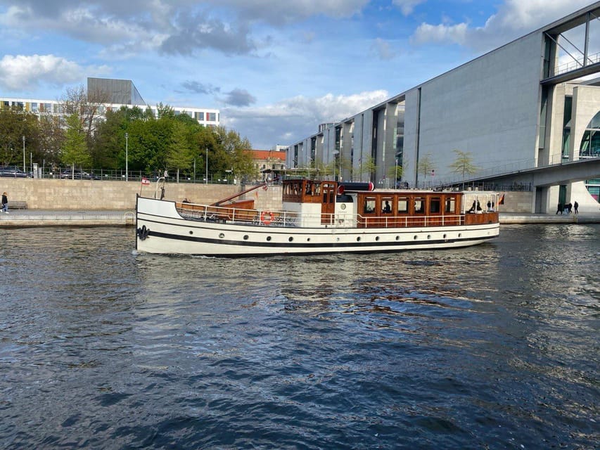Berlin: Historic Boat Sightseeing City Center Tour - Inside the experience: audio guide, music, coffee, and a crew that stays present