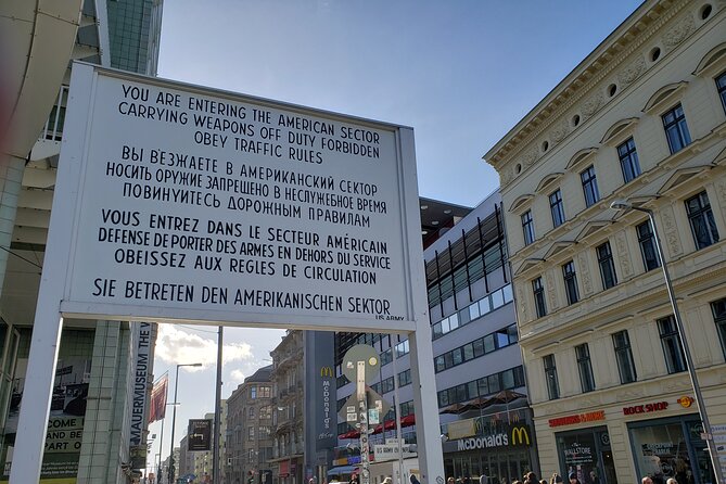 Berlin: Private Highlights Walking Tour with Local Guide and Hotel pickup - Stop 3: Checkpoint Charlie, What Borders Felt Like